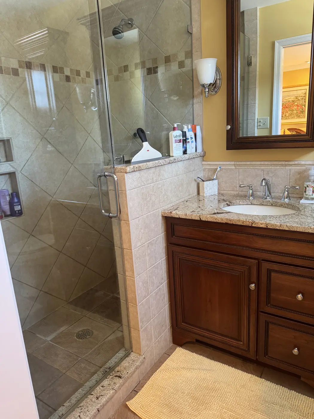 Detailed cleaning in a glass shower and bathroom