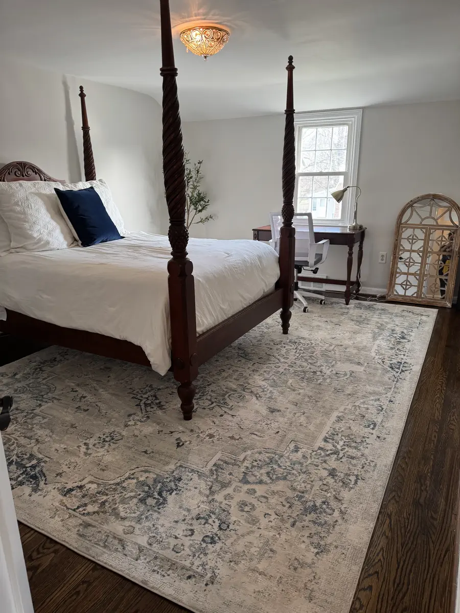 Clean bedroom with a neatly arranged rug