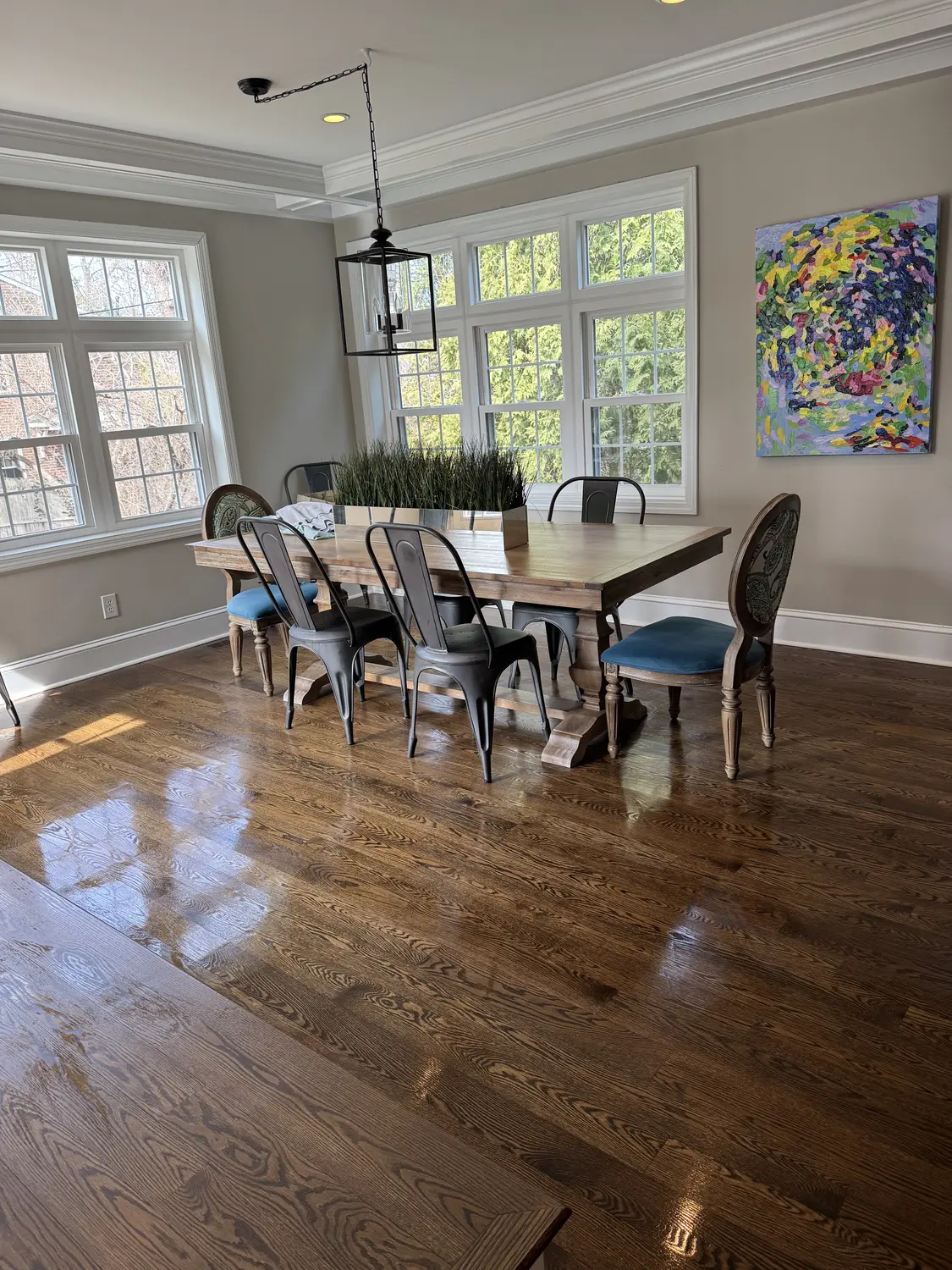Clean dining area with polished wood floors